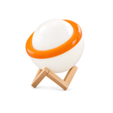 Vidar Banded Orb Table Lamp, glass orb with an orange band on a crossed wood stand, shown unlit on a white background