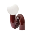 Tarquin Sculptural Loop Table Lamp, frosted glass globe on a glossy bronze base, shown unlit on a white background