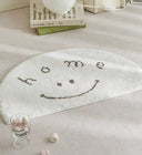 Clement Smiley Face Plush Accent Rug - Neutral Tones, Lofted Plush Pile with a Coated Grip Backing, Soft Bedside Mat