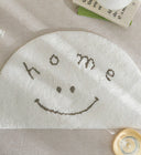 Clement Smiley Face Plush Accent Rug - Neutral Tones, Lofted Plush Pile with a Coated Grip Backing, Soft Bedside Mat