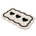 Tufted Heart Shape Bath Mat in Ivory on a white background