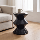 Juniper zigzag side table stool in glossy black beside a linen sofa