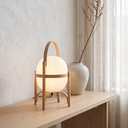Lucien wood dome lamp in light wood on a Nordic console