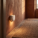 Emory stone wall lamp in a warm hallway