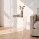 Thea acrylic two-tier side table in a sunlit reading corner