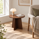 Astrid Nordic Round Side Table in the smaller 15.7 inch size beside a reading chair