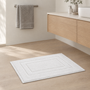 Woven Cotton Bath Mat styled in a Nordic bathroom