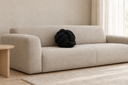 Knotted Ball Cushion in Black styled in a living room