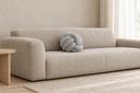 Knotted Ball Cushion in Grey styled in a living room