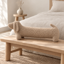 Dachshund Shaped Plush Bolster Pillow in Beige styled in a bedroom