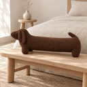 Dachshund Shaped Plush Bolster Pillow in Brown styled in a bedroom