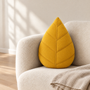 Leaf Shaped Pillow in Yellow styled in a living room