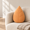 Leaf Shaped Pillow in Orange styled in a living room